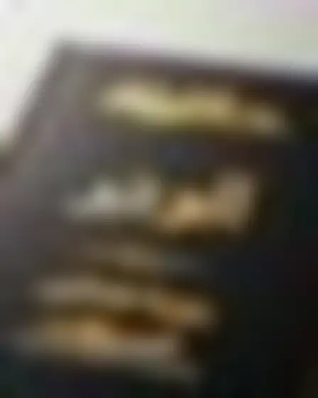 Copy-ready Ideogram 2 prompt for a luxury foil arabic magazine cover (print layout). Luxury black cover with embossed gold foil lettering, with lighting, materials, camera, angle and composition details for a 4:5 image.