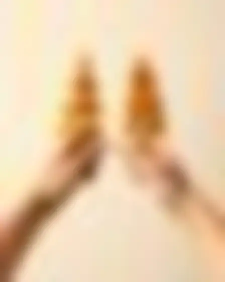 Conceptual Art AI image prompt for a boho totem shapes reaching hands: boho abstract of stacked ochre-mustard geometric totem shapes cut like paper on a pale textured cream background. Written for Flux 1.1 Pro on a 4:5 canvas, with lighting, materials, lens, angle and composition direction included.