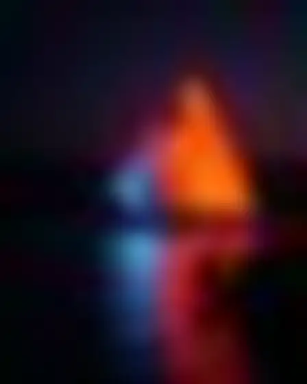 Copy-ready GPT Image prompt for a neon motion glow nile felucca (editorial illustration). Blurred long-exposure neon glow in orange and electric blue with soft motion trails on a dark ground, with lighting, materials, camera, angle and composition details for a 2:3 image.