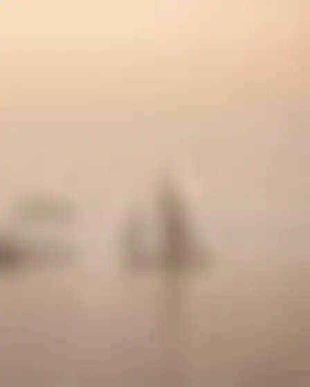 Conceptual Art AI image prompt for a misty minimal landscape nile felucca: minimal abstract landscape in washed grey and warm beige with soft horizontal bands, faint distant forms and plaster texture. Written for GPT Image on a 4:5 canvas, with lighting, materials, lens, angle and composition direction included.