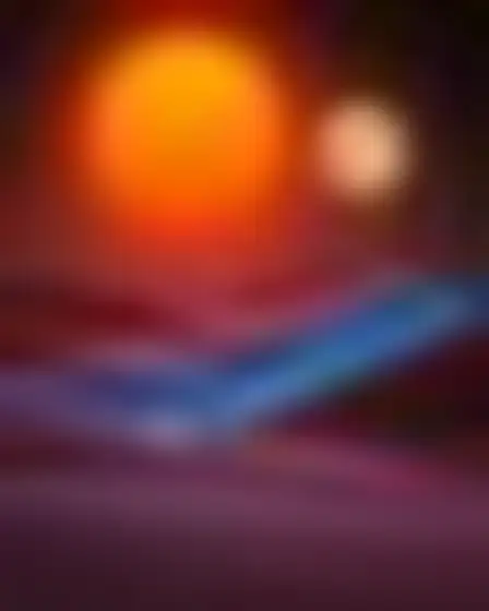 Fine Art AI image prompt for a neon motion glow desert dunes: blurred long-exposure neon glow in orange and electric blue with soft motion trails on a dark ground. Written for Flux 1.1 Pro on a 4:3 canvas, with lighting, materials, lens, angle and composition direction included.