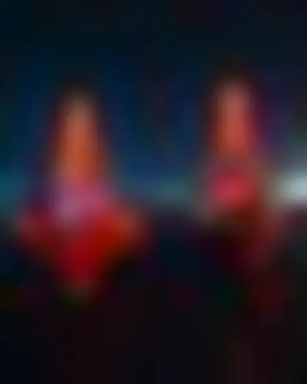 Copy-ready Imagen 4 prompt for a neon motion glow harbor boats (editorial illustration). Blurred long-exposure neon glow in orange and electric blue with soft motion trails on a dark ground, with lighting, materials, camera, angle and composition details for a 1:1 image.