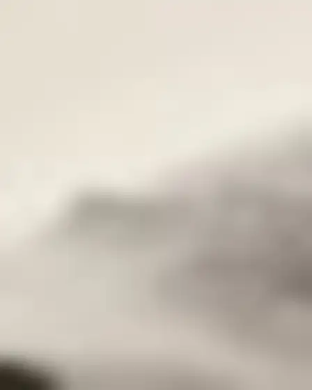 Conceptual Art AI image prompt for a misty minimal landscape hillside village: minimal abstract landscape in washed grey and warm beige with soft horizontal bands, faint distant forms and plaster texture. Written for Imagen 4 on a 4:5 canvas, with lighting, materials, lens, angle and composition direction included.