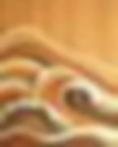 Copy-ready Stable Diffusion XL prompt for a woodgrain waves ocean waves (conceptual art). Flowing 1970s wood-grain wave lines in rust, cream, sage and brown forming layered arches and ripples like inlaid veneer, with lighting, materials, camera, angle and composition details for a 1:1 image.