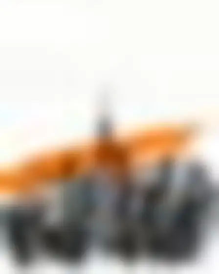 A professional digital painting prompt: scribble brushstroke city skyline, one big ochre-orange brushstroke combined with a loose black ink scribble line and splatter on white paper. Optimised for Midjourney v7 on a 4:5 canvas.