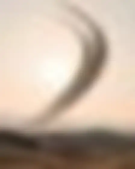 Copy-ready GPT Image prompt for a speed blur sweep sun and moon (fine art). Long-exposure motion blur of a single black sweeping brush arc with feathered speed streaks on a pale ground, with lighting, materials, camera, angle and composition details for a 1:1 image.